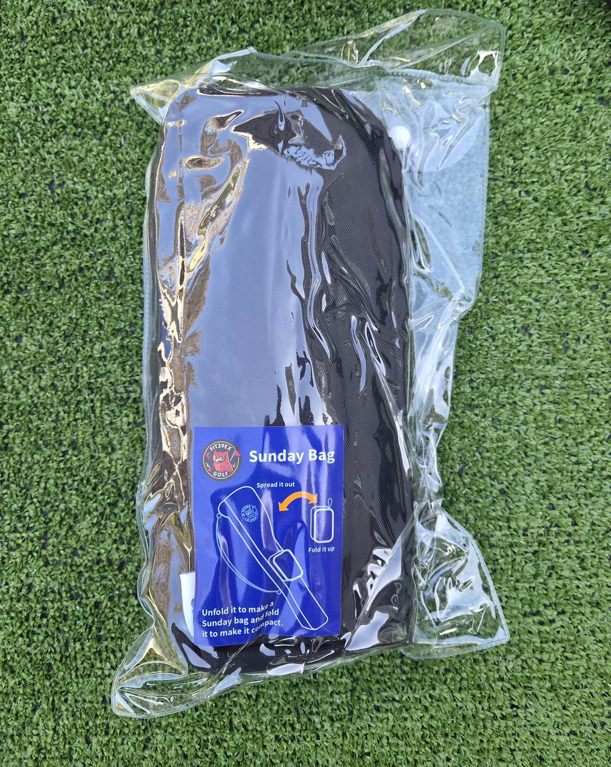 Folded Black Sunday golf bag in packaging